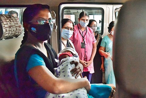 Sudheendra Mission Hospital employees bidding farewell to Gayathri and her daughter Aradhya in Kochi on Saturday | Albin Mathew