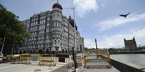 Barricades are placed outside the iconic Taj Mahal Palace hotel after a threat call of a possible terror attack in Mumbai. (File photo| PTI)