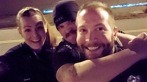 (From left) Officers Erica Marrero, Jaron Jones and Kyle Dittrich imitated the chokehold used to subdue 23-year-old Elijah McClain. (Photo| Aurora Police Department via AP)