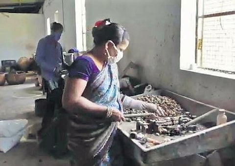 File photo of labourers working in a cashew unit in Palasa of Srikakulam district