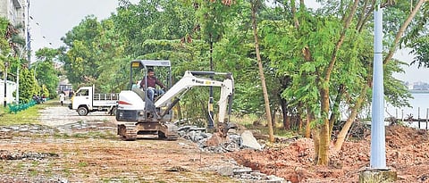 A worker engaged in the renovation of Marine Drive walkway | ALBIN MATHEW