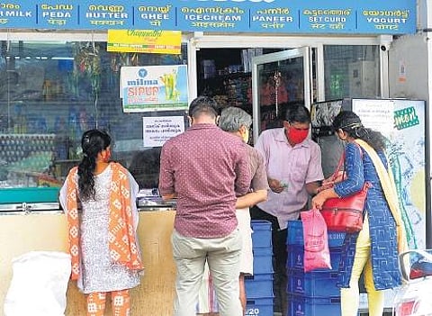 Customers crowd a shop in Kochi , A Sanesh