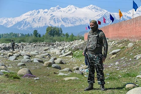 A security personnel stands guard in Pulwama district of Jammu and Kashmir. (Photo | PTI)