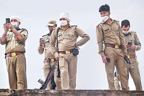 Police personnel at the residence of don Vikas Dubey in Bikaru village | PTI