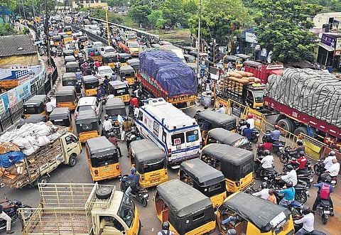 An ambulance struggling to find its way out near the Basin Bridge Junction in Chennai on Monday | P JAWAHAR