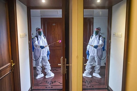 Staff of Tunga Paradise hotel carry out sanitisation after authorities declared hotels in the city will be allowed 33 occupancy during Unlock 2.0 in Mumbai Tuesday July 7 2020. (Photo | PTI)