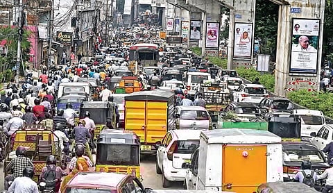 Vehicles move at a snail’s pace on a road nearby, owing to the demolition process | VINAY MADAPU