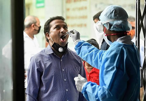 A health worker takes swab samples for COVID-19 testing during Unlock 2.0 in Ghaziabad Wednesday July 8 2020. (Photo | PTI)