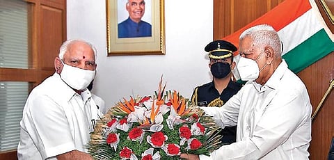 Chief Minister B S Yediyurappa meets Governor Vajubhai Vala at Raj Bhavan on Friday in Bengaluru | Express