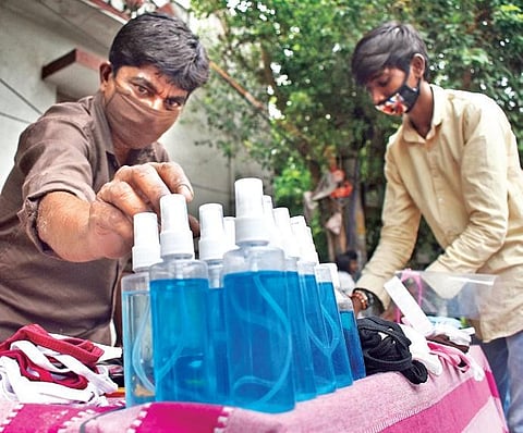 People sell hand sanitisers, which are illegally manufactured, on a street in Hyderabad on Sunday (Photo | S Senbagapandiyan, EPS)