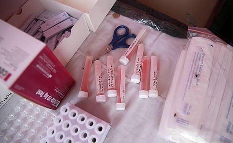 Health workers prepare for COVID- 19 testing through rapid antigen methodology at a neighborhood in New Delhi on Friday. (Photo | Shekhar Yadav/EPS)