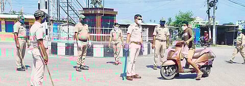 Cops enforcing lockdown restrictions in Aska of Ganjam district which is worst-affected by Covid-19 I Express