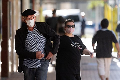 People walk down a street in Wellington. (Photo | AFP)