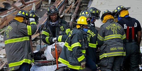 Baltimore City Fire Department carries a person out from the debris after an explosion in Baltimore on Monday, Aug. 10, 2020. (Photo | AP)