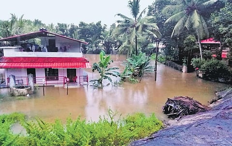 A house surrounded by floodwater at Edanad, which is located near Varattar river