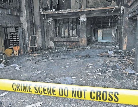 Police tape mark off Hotel Swarna Palace, where 10 patients were killed in a fire accident on Sunday, in Vijayawada (Photo | Prasant Madugula, EPS)