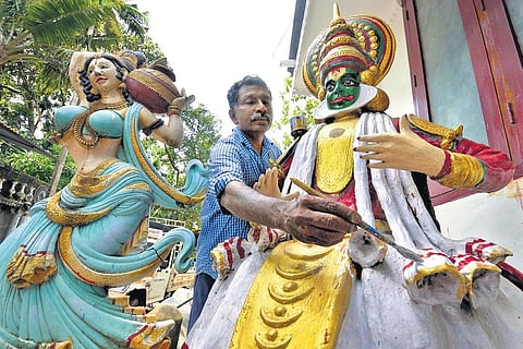 G Uthamadas giving finishing touches to a sculpture he made at his warehouse at Kalliyoor in Thiruvananathapuram on Tuesday