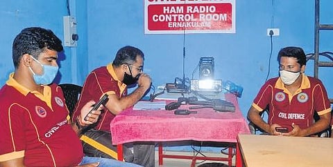 Officials from the civil defence wing of Kerala Fire and Rescue Services operating HAM radio at Gandhinagar fire station in Kochi , A Sanesh