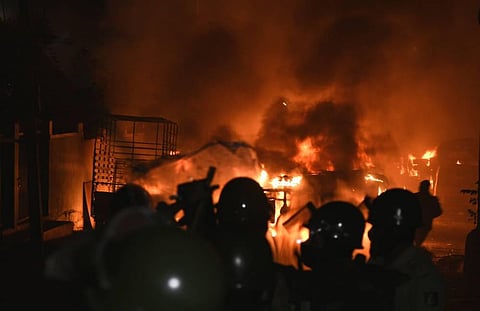 Police vehicles torched in front of DJ Halli police station in Bengaluru on Tuesday night. (Photo | Vinod Kumar T, EPS)