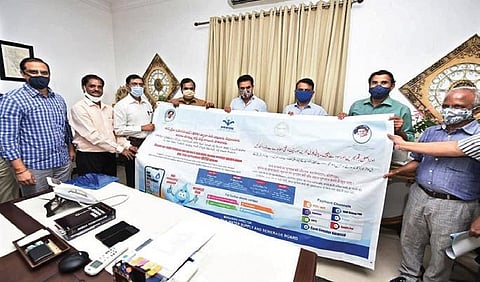 MAUD Minister KT Rama Rao releases pamphlets and wall posters to spread awareness about the new OTS scheme, on Tuesday.