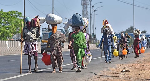 Migrant labourers walking back home during lockdown due to coronavirus pandemic.