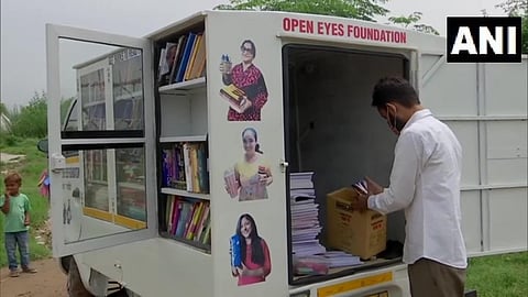 Sandeep Kumar from Mohali runs a mobile library & provides books/study material to children living in slums. (Photo | ANI)