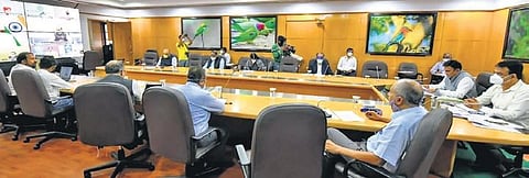 Deputy CM Dr C N Ashwath Narayan and Medical Education Minister Dr K Sudhakar brief PM Narendra Modi during a video conference in Bengaluru on Tuesday.