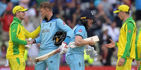 England captain Eoin Morgan and teammate Joe Root shake hands with Australia's Steve Smith in the 2019 Cricket World Cup semi-final at Birmingham. (File photo| AFP)