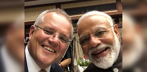 Australian Prime Minister Scott Morrison (L) and PM Narendra Modi click a selfie. (Photo| Twitter)