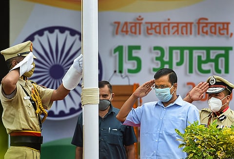 Delhi Chief Minister Arvind Kejriwal salutes after hoisting the Tricolor during the 74th Independence Day celebrations.