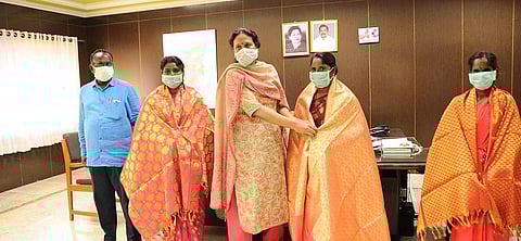 District Collector V Santha honored the three women who saved the two youths in Kottarai village in Perambalur district. (Photo | Express)