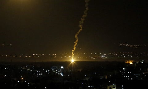 Flares fired by Israeli forces light up the night sky in Gaza City. (File Photo | AP)