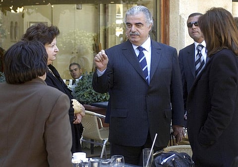In this 2005 file photo, former Lebanese Prime Minister Rafik Hariri, center, speaks to people outside the Lebanese Parliament minutes before an explosion killed him and 22 others. (Photo | AP)
