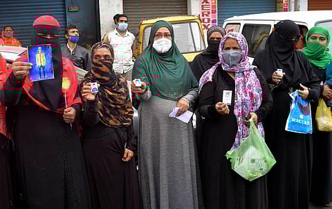 After 342 men have been arrested in DJ Halli women take to the streets to protest in front of the police station. (Photo | Meghana Sastry/EPS)