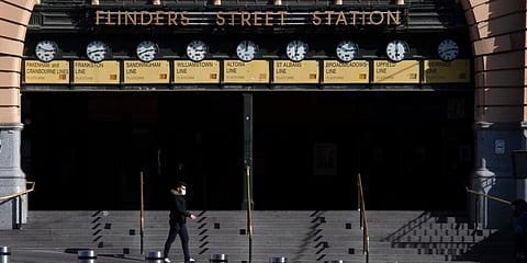 A masked man at Flinders Street Station during lockdown due to the continuing spread of the coronavirus in Melbourne, Australia. (Photo | AP)
