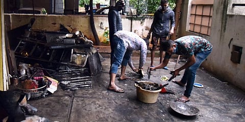 Remnants of the cylinders that exploded being moved out (Photo | S Senbagapandiyan, EPS)