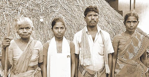 M Dhanalakshmi, who hit the headlines for taking on her villagers and officials to secure a community certificate, with her family in a Irula hamlet in Vaanur taluk.
