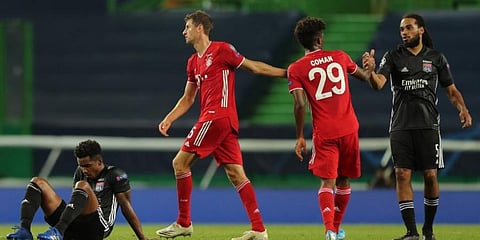 Bayern Munich's Thomas Mueller and Kingsley Coman are congratulated by Lyon's Jason Denayer at the end of the UEFA Champions League semifinal. (Photo | AFP)