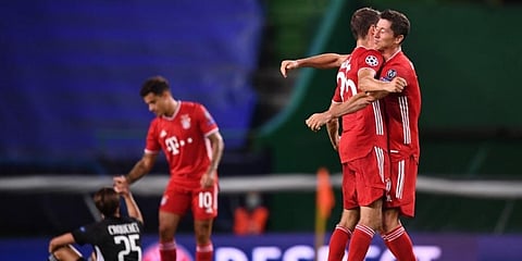 Bayern Munich forwards Robert Lewandowski (R) and Thomas Mueller at the end of Champions League semifinal match against Lyon at Lisbon's Jose Alvalade stadium. (Photo | AFP)