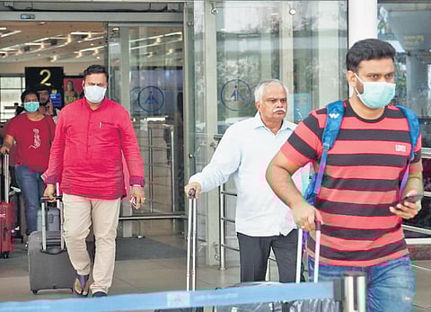 Passengers with masks at Vijayawada airport. (Photo | EPS)