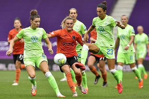 Wolfsburg's German defender Sara Doorsoun kicks the ball during the UEFA Women's Champions League quarter-final football match between Glasgow City FC and VfL Wolfsburg (Photo | AFP)