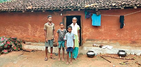 Easter with her brothers outside their house in Jaralota, Sundergarh | EXpress