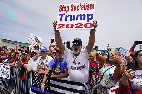 People people cheer as they wait to hear President Donald Trump speak at Asheville Regional Airport, Monday, Aug. 24, 2020, in Fletcher, N.C. (Photo | AP)