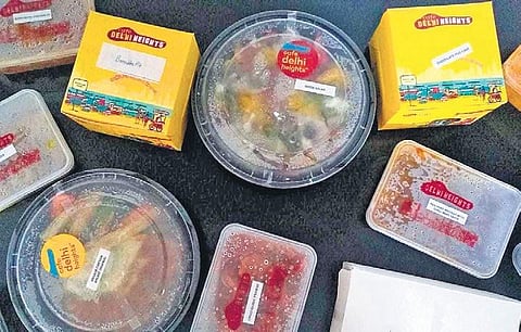 (From left) Juicy Lucy; Café Delhi Heights’ home delivery packaging; Banoffee Pie