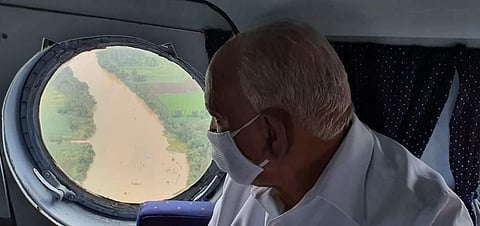 CM B S Yediyurappa doing an aerial survey of flood-hit areas in North Karnataka on Tuesday. (Photo | EPS)