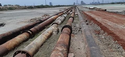 100 households was painted grey after fly ash slurry leaked from a busted pipeline of the North Chennai Thermal Power Station. (Photo | Express)