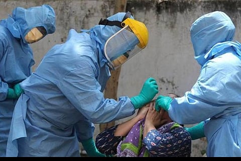 Health workers collect swab samples for coronavirus testing. Image used for representational purpose. (File Photo | PTI)