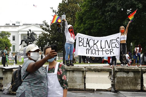 Protesters gather on a part of 16th Street Northwest renamed Black Lives Matter Plaza near the White House in Washington. (File Photo | AP)