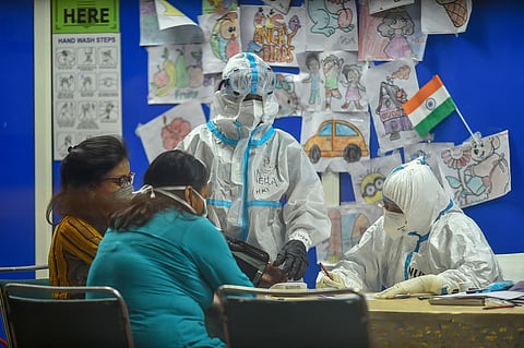 COVID-19 infected patients interact with health workers. (Photo | PTI)