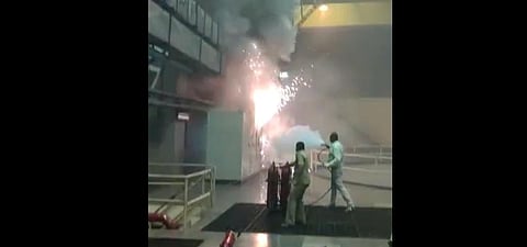 Employees trying to douse the fire in the Srisailam Hydro Electric power plant.